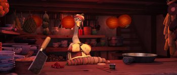 Movie still from “Kung Fu Panda 3” (2016), directed by Jennifer Yuh Nelson – An animated bird sitting on top of a wooden table; Medium shot, Over the shoulder angle