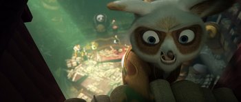 Movie still from “Kung Fu Panda 3” (2016), directed by Jennifer Yuh Nelson – A stuffed animal sitting on top of a table; Close Up shot, Low angle