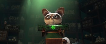 Movie still from “Kung Fu Panda 3” (2016), directed by Jennifer Yuh Nelson – A cat holding something in its mouth with its eyes wide open; Close Up shot, Low angle