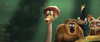 Movie still from “Kung Fu Panda 3” (2016), directed by Jennifer Yuh Nelson – An ostrich wearing a hat next to a monkey; Close Up shot, Low angle