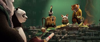 Movie still from “Kung Fu Panda 3” (2016), directed by Jennifer Yuh Nelson – A group of cartoon characters sitting on top of a pile of logs; Wide shot, Low angle
