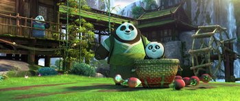 Movie still from “Kung Fu Panda 3” (2016), directed by Jennifer Yuh Nelson – A couple of panda bears sitting in a basket; Wide shot, Low angle