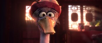 Movie still from “Kung Fu Panda 3” (2016), directed by Jennifer Yuh Nelson – An ostrich wearing a red hat and a white beak; Close Up shot, Over the shoulder angle
