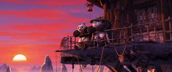 Movie still from “Kung Fu Panda 3” (2016), directed by Jennifer Yuh Nelson – A couple of panda bears sitting on top of a wooden platform; Wide shot, Low angle