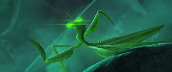 Movie still from “Kung Fu Panda 3” (2016), directed by Jennifer Yuh Nelson – A green praying mantis with a green background; Extreme Close Up shot, Low angle