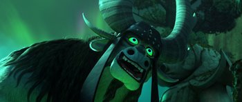 Movie still from “Kung Fu Panda 3” (2016), directed by Jennifer Yuh Nelson – A horned creature with a green background; Close Up shot, Low angle