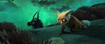 Movie still from “Kung Fu Panda 3” (2016), directed by Jennifer Yuh Nelson – An animated creature with a horned creature in the background; Wide shot, High angle