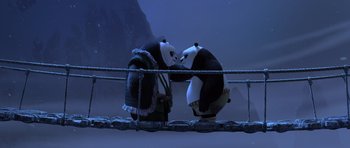 Movie still from “Kung Fu Panda 3” (2016), directed by Jennifer Yuh Nelson – A couple of panda bears standing next to each other on top of a bridge; Wide shot, High angle