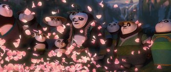 Movie still from “Kung Fu Panda 3” (2016), directed by Jennifer Yuh Nelson – A group of people that are standing in the grass; Wide shot, Low angle