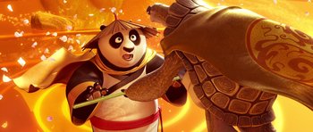 Movie still from “Kung Fu Panda 3” (2016), directed by Jennifer Yuh Nelson – A panda bear holding a sword in front of a turtle; Close Up shot, Over the shoulder angle