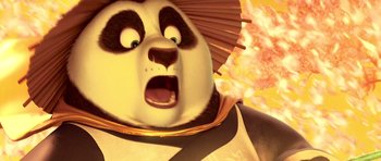 Movie still from “Kung Fu Panda 3” (2016), directed by Jennifer Yuh Nelson – A panda bear's face with a surprised look on his face; Close Up shot, Low angle