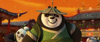 Movie still from “Kung Fu Panda 3” (2016), directed by Jennifer Yuh Nelson – A smiling panda bear wearing a green outfit and an umbrella hat; Close Up shot, Low angle