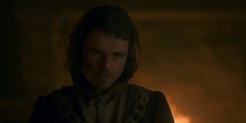 Movie still from “House of the Dragon” (2022), created by George R.R. Martin – A person with long dark hair; Close Up shot, Over the shoulder angle