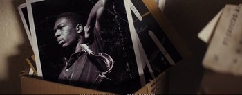 Movie still from “La La Land” (2016), directed by Damien Chazelle – Picture of a person holding a saxophone; Extreme Close Up shot, High angle