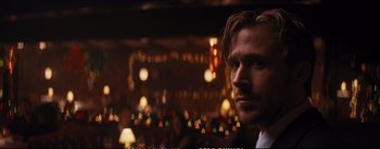 Movie still from “La La Land” (2016), directed by Damien Chazelle – A person in a room with lights in the background; Close Up shot, Over the shoulder angle