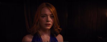 Movie still from “La La Land” (2016), directed by Damien Chazelle – A person with red hair; Close Up shot, Over the shoulder angle