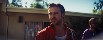 Movie still from “La La Land” (2016), directed by Damien Chazelle – A person wearing a red jacket; Close Up shot, Over the shoulder angle