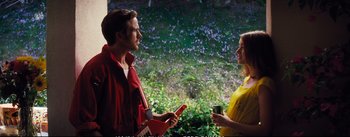 Movie still from “La La Land” (2016), directed by Damien Chazelle – A man and a woman are talking in a field; Medium shot, Over the shoulder angle