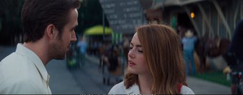 Movie still from “La La Land” (2016), directed by Damien Chazelle – A man and a woman standing next to each other on the street; Close Up shot, Over the shoulder angle