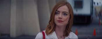 Movie still from “La La Land” (2016), directed by Damien Chazelle – A person with red hair and blue eyes; Close Up shot, Over the shoulder angle