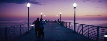 Movie still from “La La Land” (2016), directed by Damien Chazelle – Two people standing on a pier at night; Wide shot, High angle