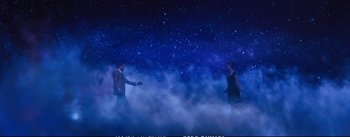 Movie still from “La La Land” (2016), directed by Damien Chazelle – A man and a woman are standing in the fog; Wide shot, Low angle