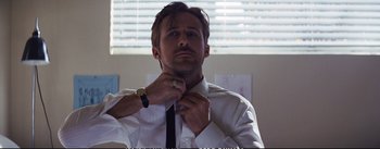 Movie still from “La La Land” (2016), directed by Damien Chazelle – A man in a white shirt and a black neck tie; Close Up shot, Low angle