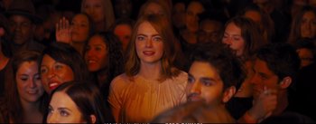 Movie still from “La La Land” (2016), directed by Damien Chazelle – A person in a crowd of people; Medium shot, Over the shoulder angle