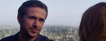 Movie still from “La La Land” (2016), directed by Damien Chazelle – A person with a city in the background; Close Up shot, Over the shoulder angle