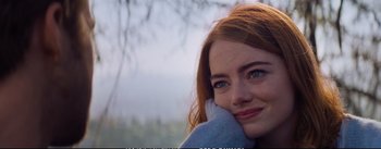 Movie still from “La La Land” (2016), directed by Damien Chazelle – A person wearing a sweater; Close Up shot, Over the shoulder angle