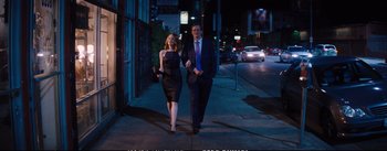 Movie still from “La La Land” (2016), directed by Damien Chazelle – A man and a woman walking down a street at night; Wide shot, Low angle