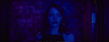 Movie still from “La La Land” (2016), directed by Damien Chazelle – A woman in a black dress is in a dark room; Close Up shot, Overhead angle