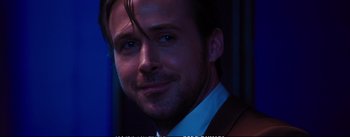 Movie still from “La La Land” (2016), directed by Damien Chazelle – A person wearing a suit and tie; Close Up shot, Over the shoulder angle