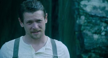 Movie still from “Lady Chatterley's Lover” (2022), directed by Laure de Clermont-Tonnerre – A person wearing a white shirt; Close Up shot, Over the shoulder angle