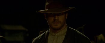 Movie still from “Lawless” (2012), directed by John Hillcoat – A person wearing a hat; Close Up shot, Low angle