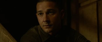 Movie still from “Lawless” (2012), directed by John Hillcoat – A person wearing a brown shirt; Close Up shot, Low angle