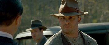 Movie still from “Lawless” (2012), directed by John Hillcoat – Close Up shot, Over the shoulder angle