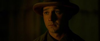 Movie still from “Lawless” (2012), directed by John Hillcoat – A person wearing a hat; Close Up shot, Low angle