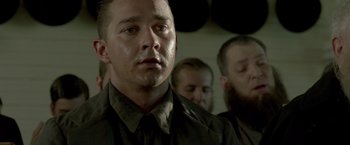 Movie still from “Lawless” (2012), directed by John Hillcoat – A person wearing a shirt and a tie; Close Up shot, Low angle