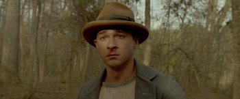 Movie still from “Lawless” (2012), directed by John Hillcoat – A person wearing a hat; Close Up shot, Low angle