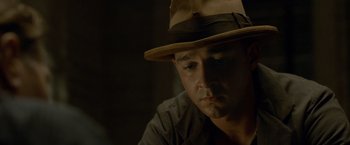 Movie still from “Lawless” (2012), directed by John Hillcoat – A person wearing a hat; Close Up shot, Low angle