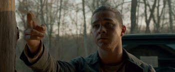 Movie still from “Lawless” (2012), directed by John Hillcoat – A person holding something in his hand; Close Up shot, Low angle