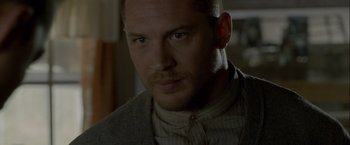 Movie still from “Lawless” (2012), directed by John Hillcoat – A person with a beard; Close Up shot, Over the shoulder angle