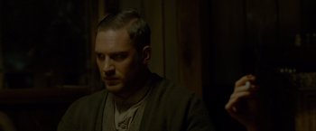 Movie still from “Lawless” (2012), directed by John Hillcoat – A person wearing a sweater; Close Up shot, Over the shoulder angle
