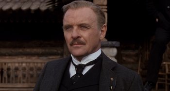 Movie still from “Legends of the Fall” (1994), directed by Edward Zwick – A person wearing a suit and tie; Close Up shot, Low angle