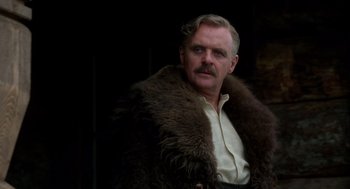 Movie still from “Legends of the Fall” (1994), directed by Edward Zwick – A man with a beard and mustache wearing a fur coat; Close Up shot, Low angle