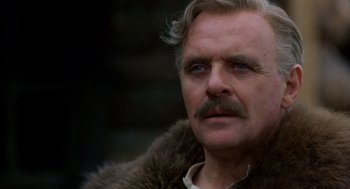 Movie still from “Legends of the Fall” (1994), directed by Edward Zwick – An older man with a mustache and a beard; Close Up shot, Low angle