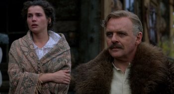 Movie still from “Legends of the Fall” (1994), directed by Edward Zwick – A man and a woman standing next to each other; Close Up shot, Over the shoulder angle