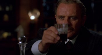 Movie still from “Legends of the Fall” (1994), directed by Edward Zwick – A man holding a glass in his hand; Close Up shot, Low angle