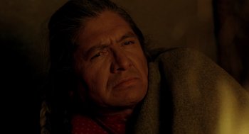 Movie still from “Legends of the Fall” (1994), directed by Edward Zwick – An older man with a sad look on his face; Close Up shot, High angle